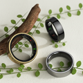Three quantum rings leaning against a branch. 